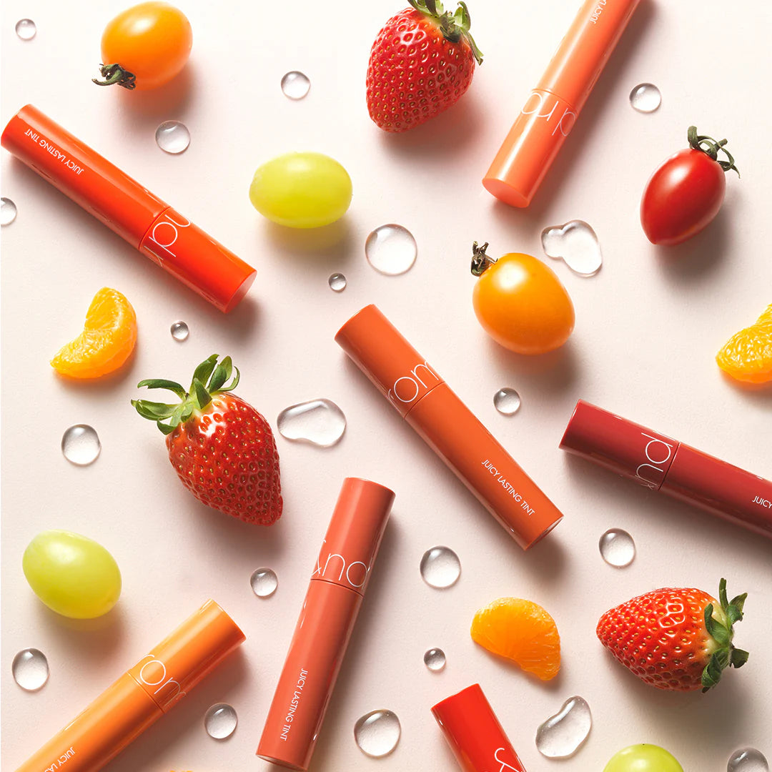 Coral lip tint in Litchi shade. Moisturizing, glossy, and long-lasting.